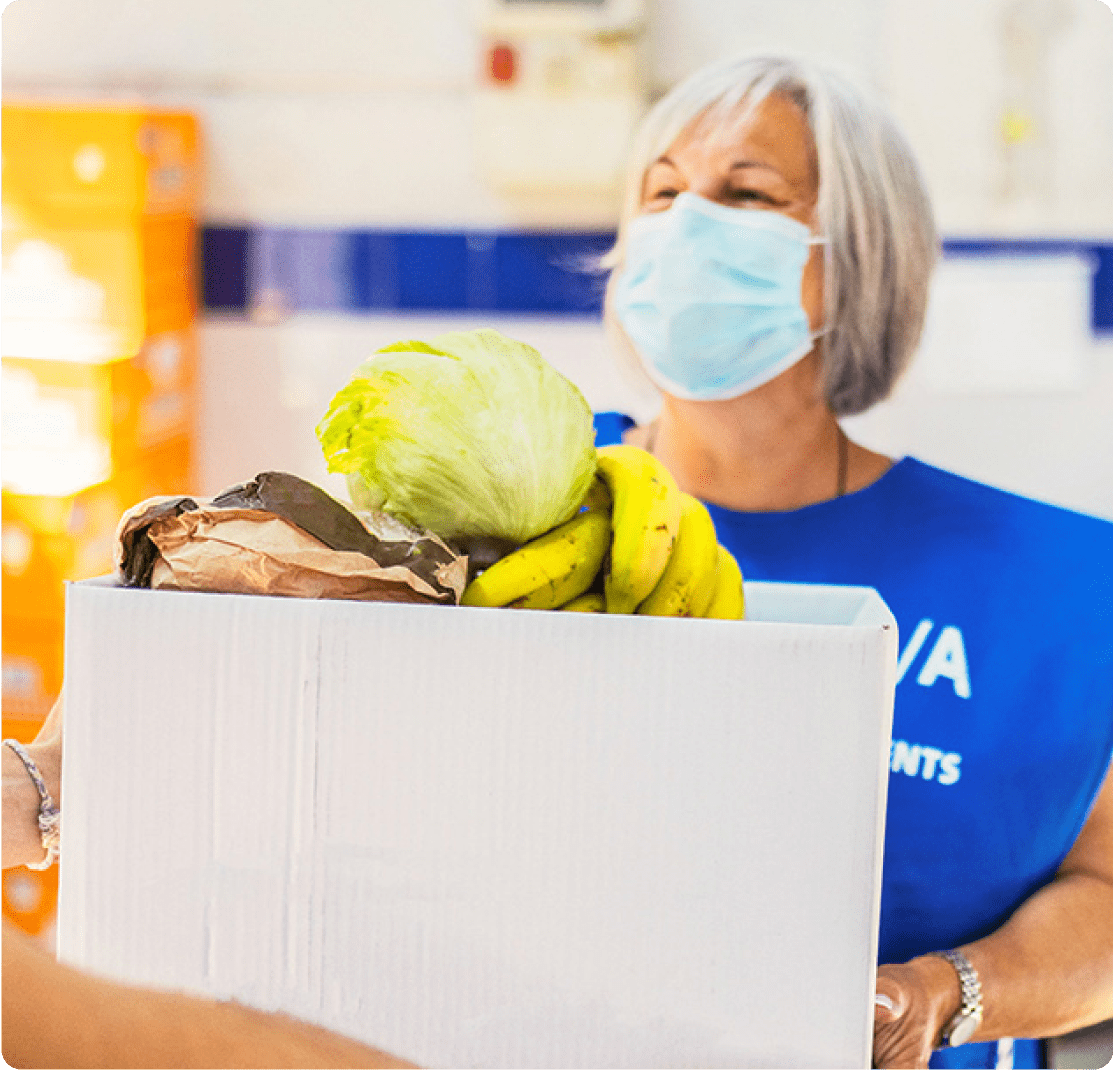 Woman holding a box of groceries